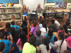 Reading Kauai Forest Bird Books to local students